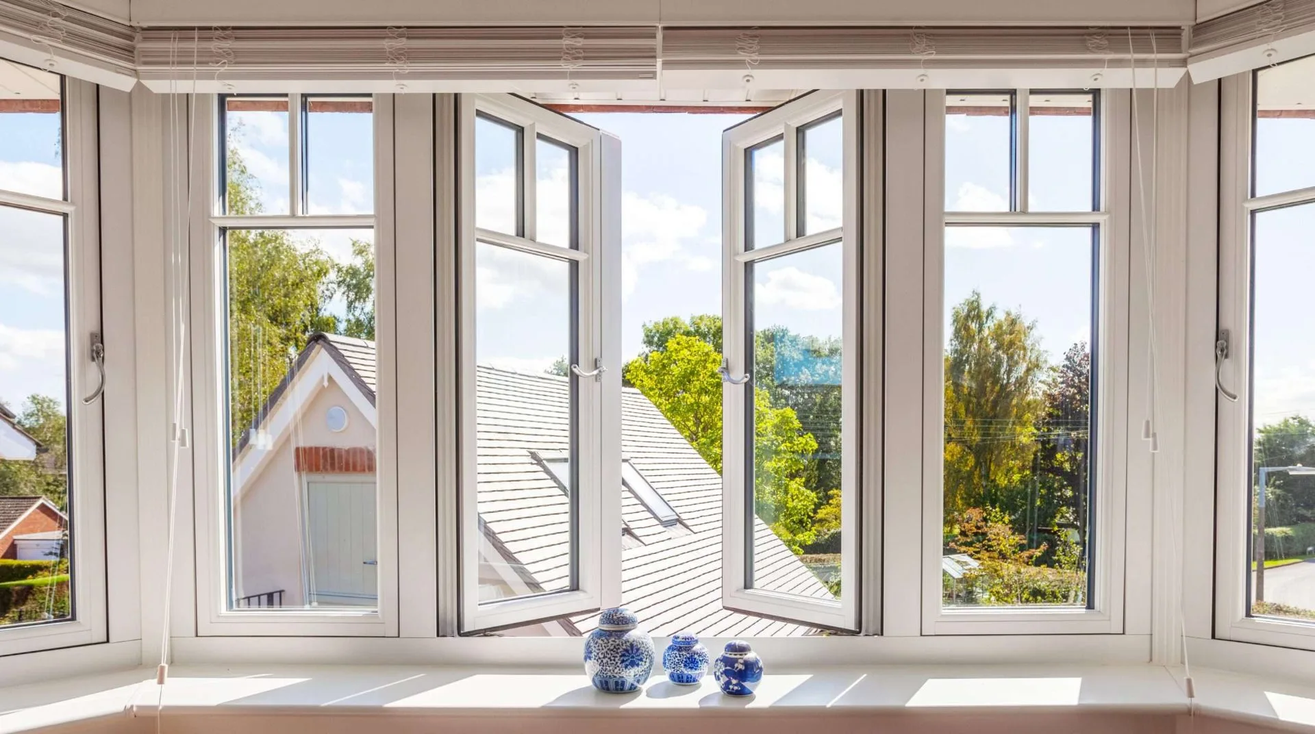 Conservatory interior with multiple opened casement windows