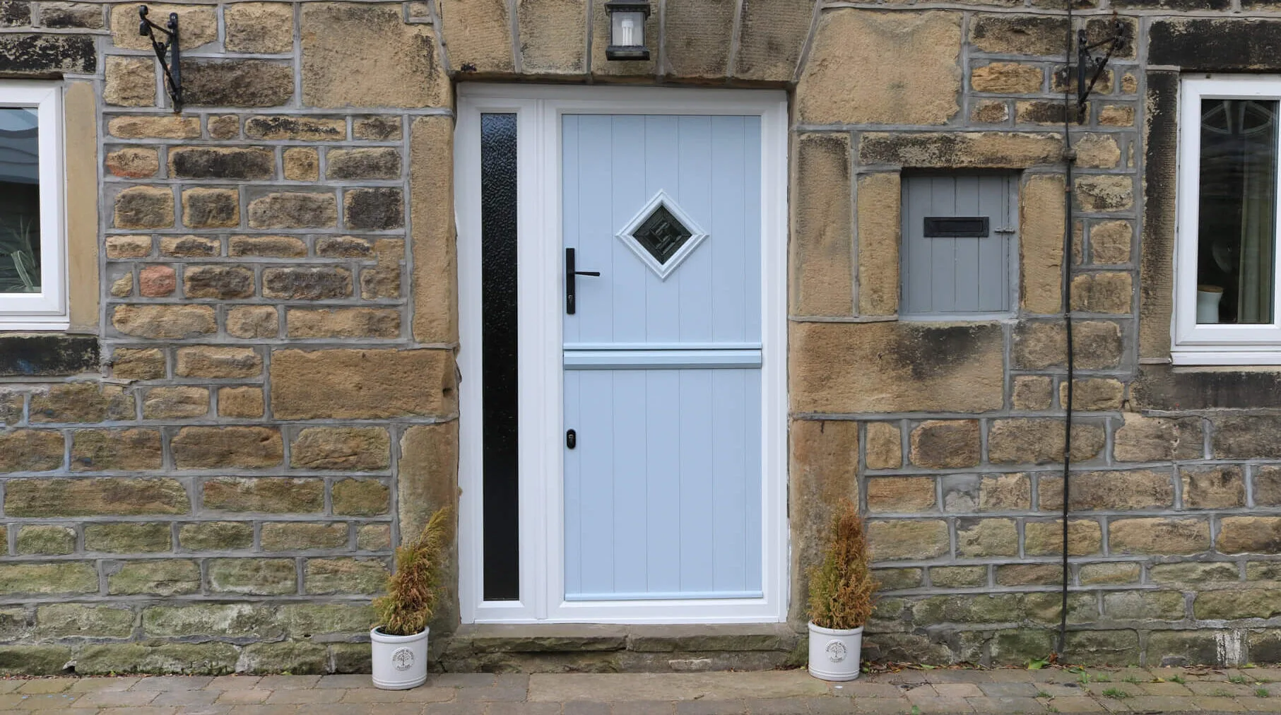 Composite stable door in light blue with diamond glass panel